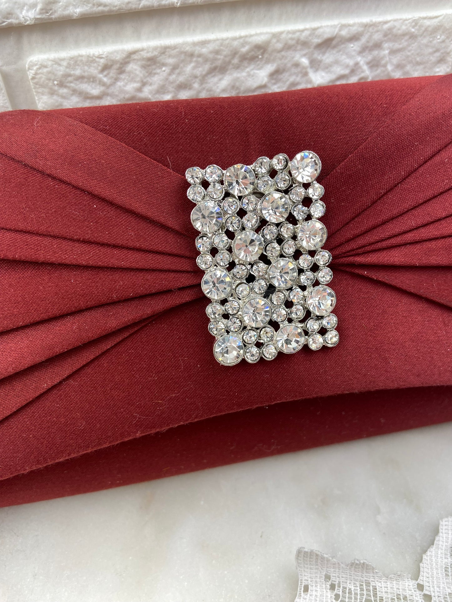 Pleated Satin Clutch with Metal Strap and Rhinestone Embellishment by Roberto Vianni