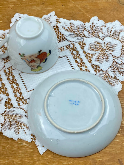 Delicate Hand Painted Child’s Teacup and Saucer Set Featuring Child and Bunny