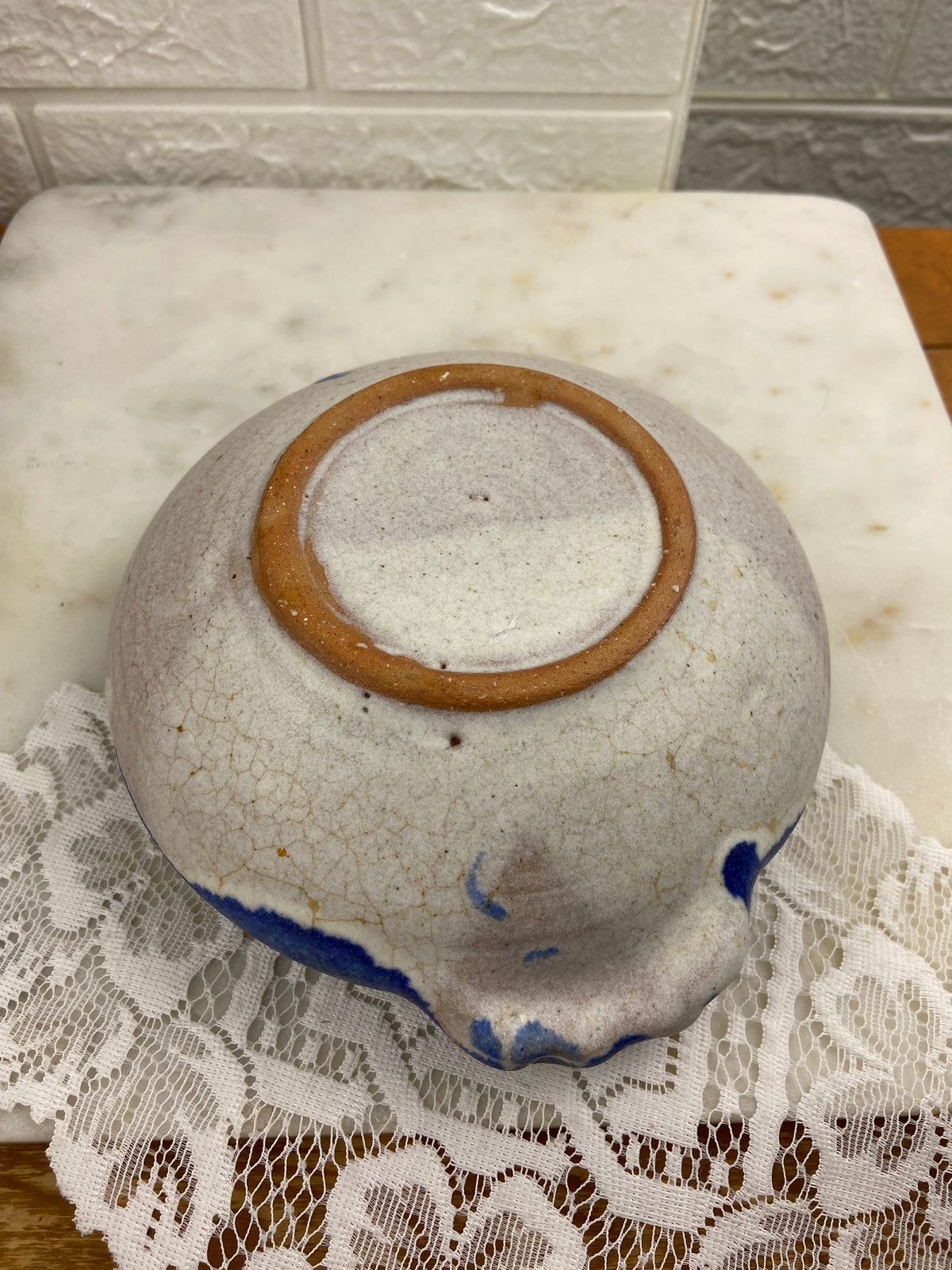 Handcrafted Speckled Pottery Bowl with Blue Rim and Double Handles