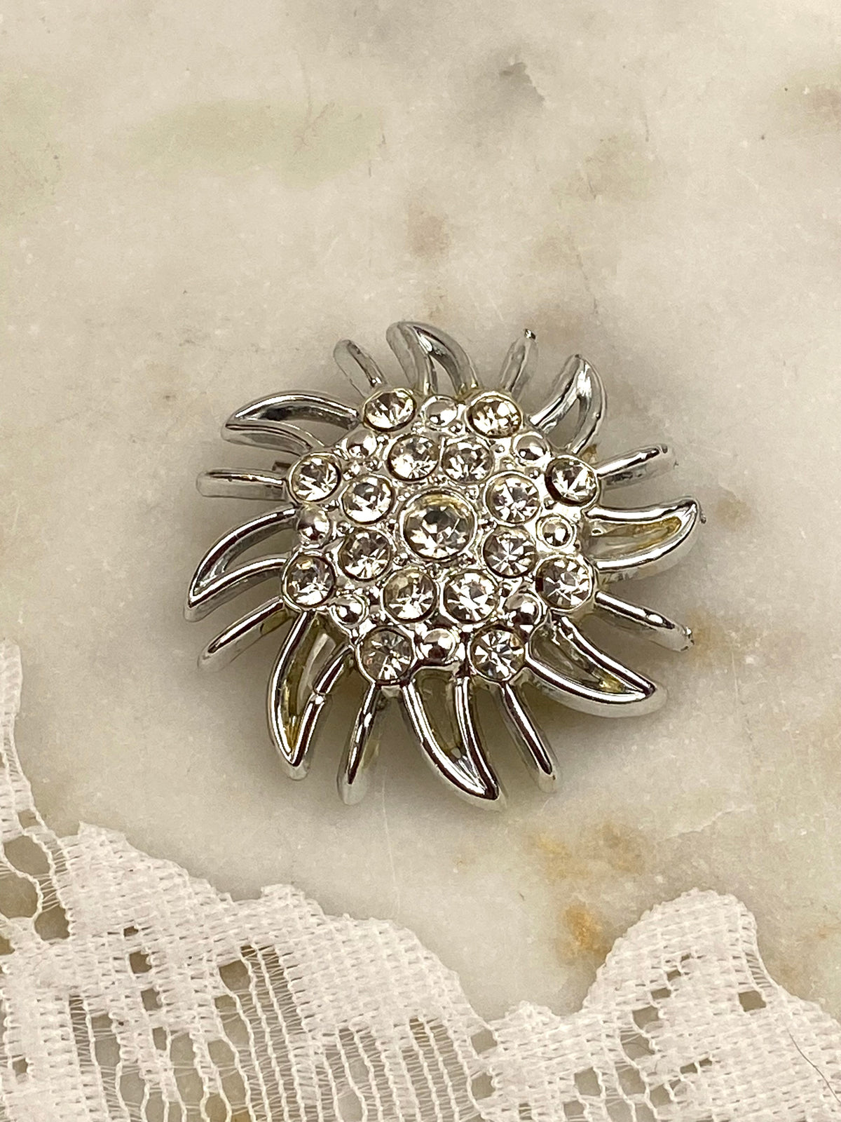 Silver-Tone Sunburst Brooch with Rhinestones