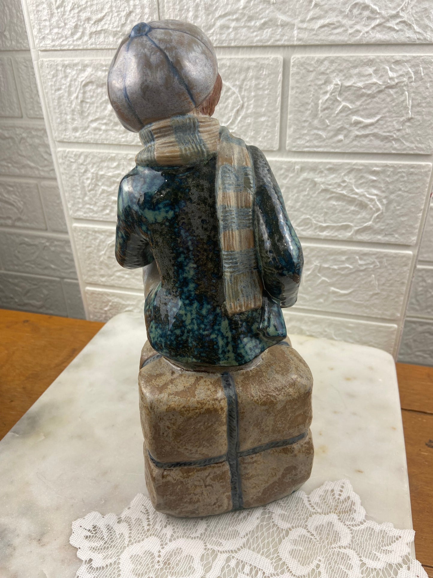 Porcelain Figurine | Boy Sitting on Cargo by Porcelana Artistica Levantina (PAL)