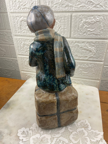 Porcelain Figurine | Boy Sitting on Cargo by Porcelana Artistica Levantina (PAL)