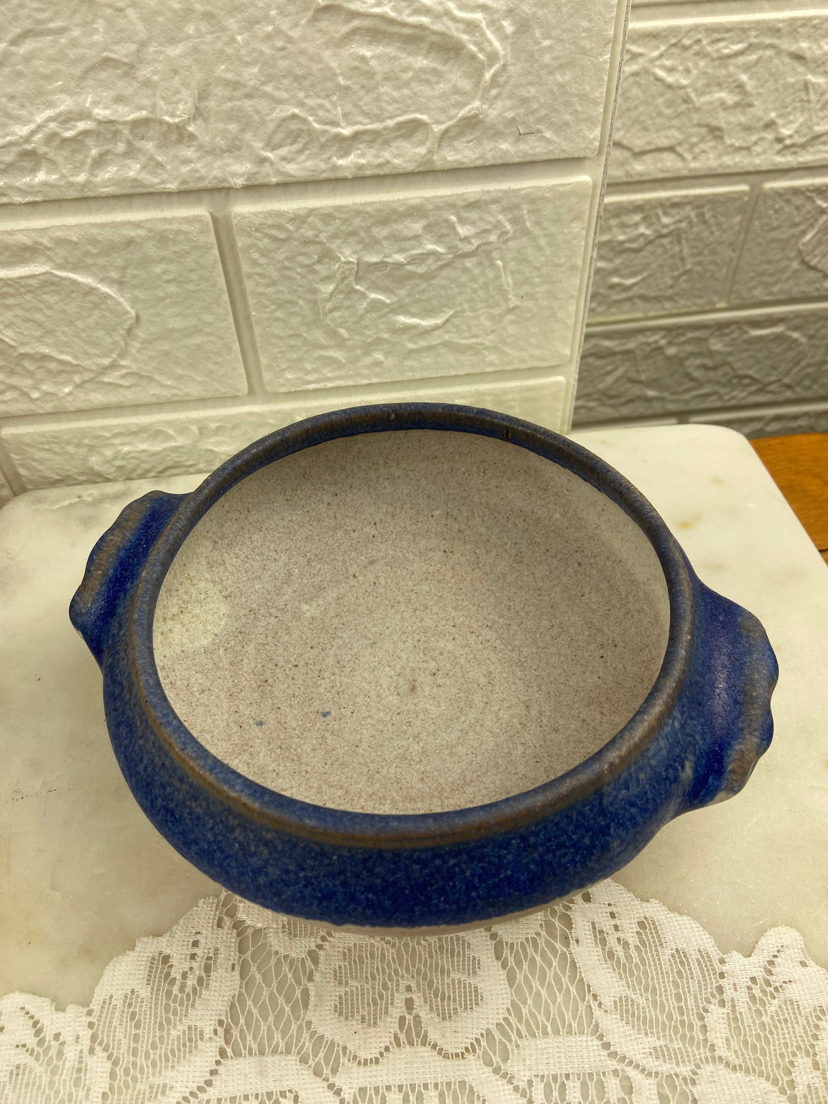 Handcrafted Speckled Pottery Bowl with Blue Rim and Double Handles