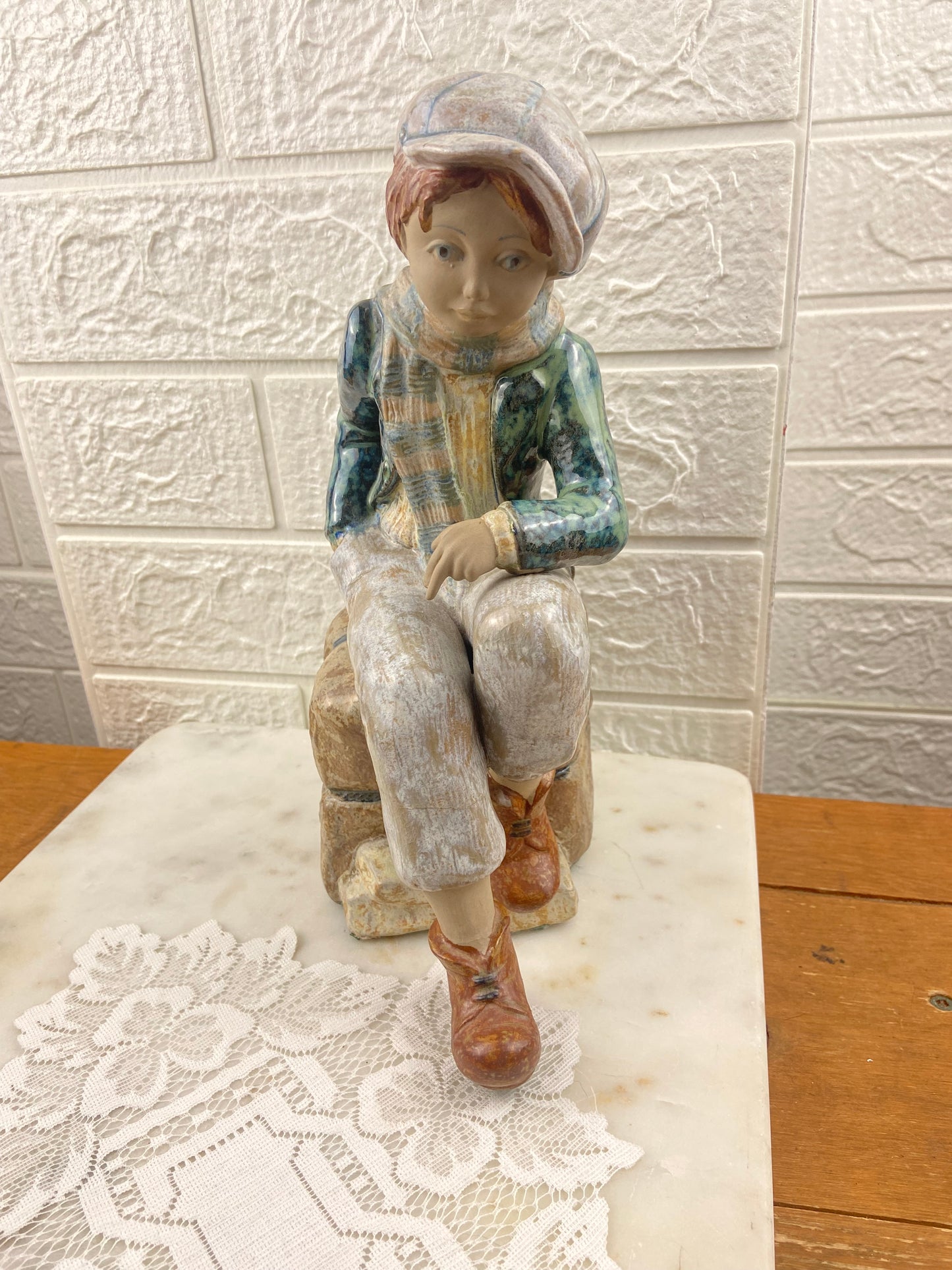 Porcelain Figurine | Boy Sitting on Cargo by Porcelana Artistica Levantina (PAL)