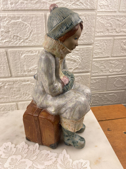 Porcelain Figurine | Girl Sitting on Luggage by Porcelana Artistica Levantina (PAL)