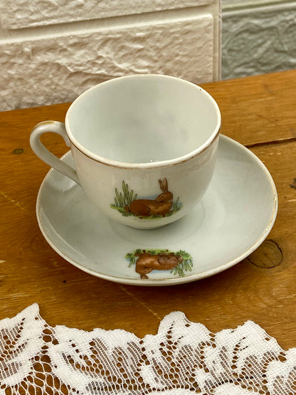 Delicate Hand Painted Child’s Teacup and Saucer Set Featuring Child and Bunny