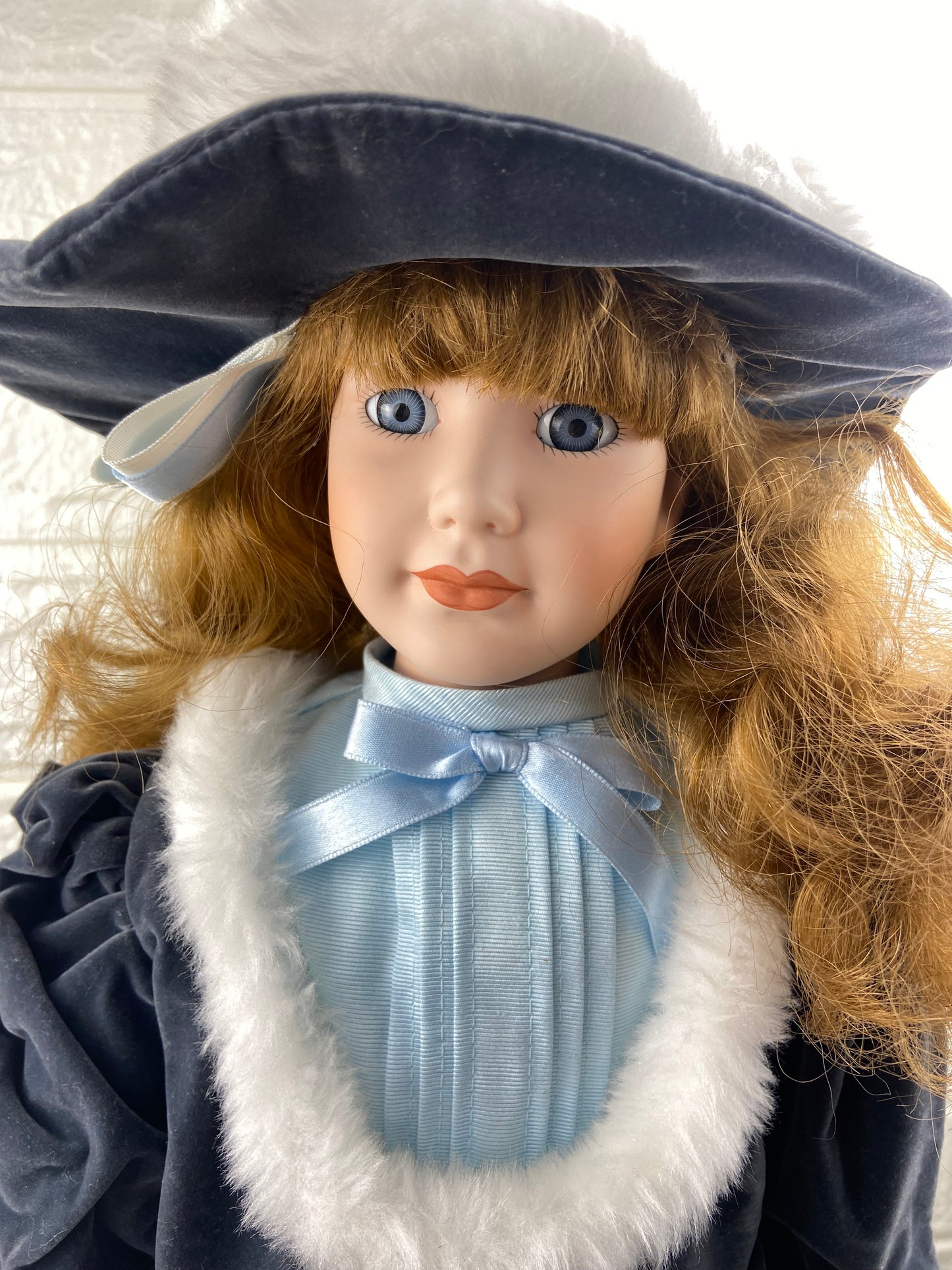 19” Bisque Porcelain Doll with Blue Velvet Dress, Pantaloons and Hat | Includes Metal Doll Stand