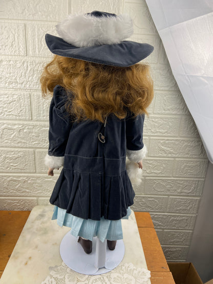 19” Bisque Porcelain Doll with Blue Velvet Dress, Pantaloons and Hat | Includes Metal Doll Stand