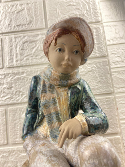 Porcelain Figurine | Boy Sitting on Cargo by Porcelana Artistica Levantina (PAL)