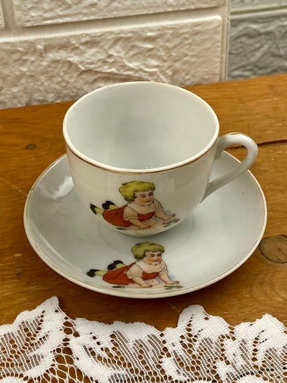 Delicate Hand Painted Child’s Teacup and Saucer Set Featuring Child and Bunny