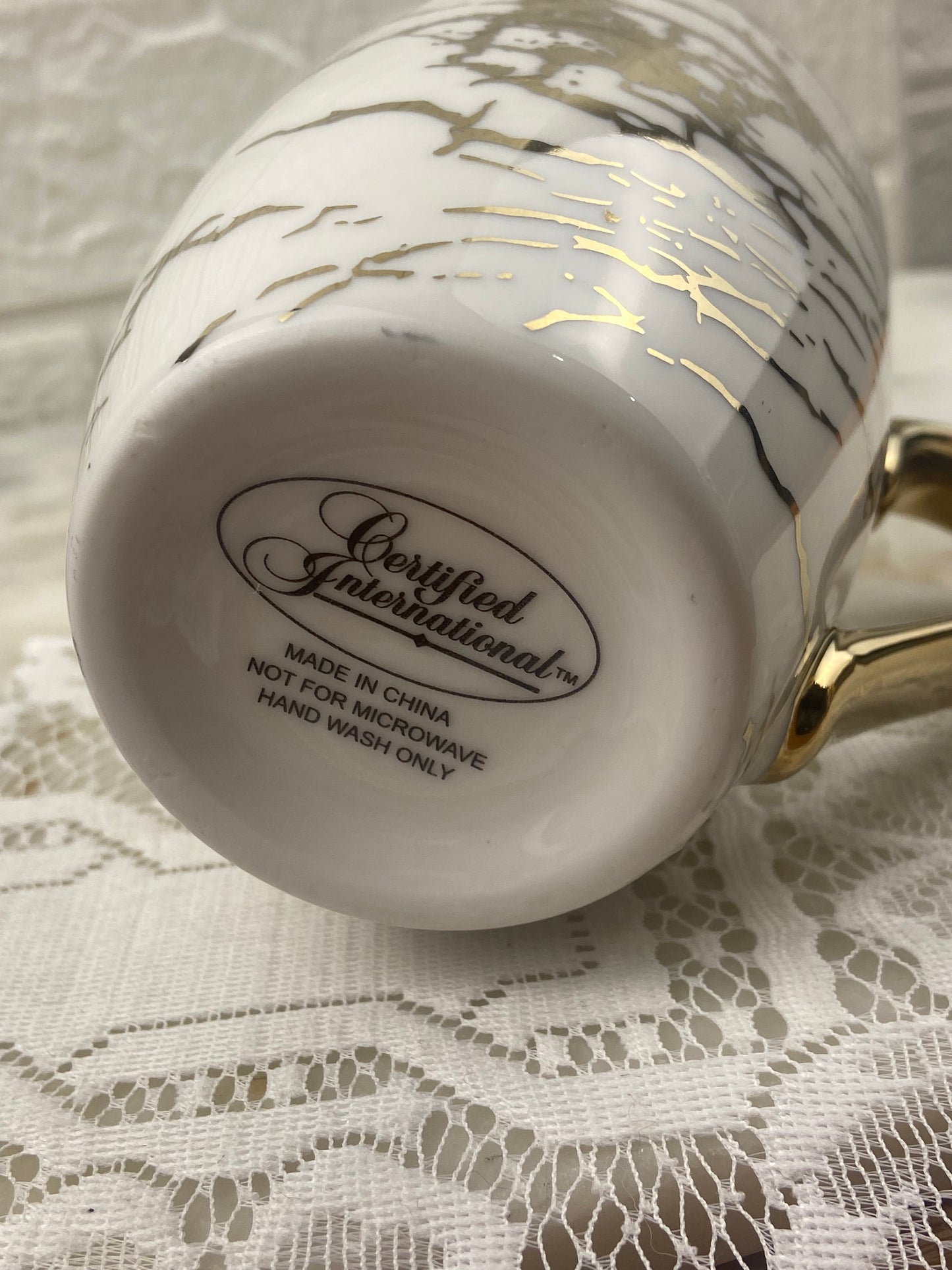 White and Gold-Tone Marbled Coffee Mug by Certified International