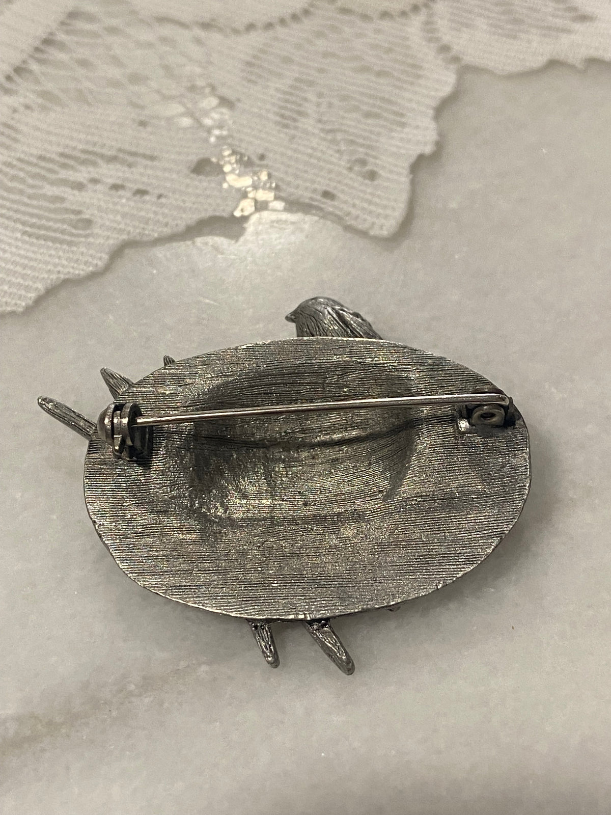 Pewter Hat Brooch with Bird, Bow and Paintbrushes by Marjolein Bastin