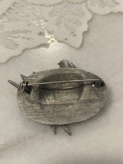 Pewter Hat Brooch with Bird, Bow and Paintbrushes by Marjolein Bastin